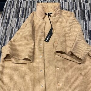 Gently used. Original tags.